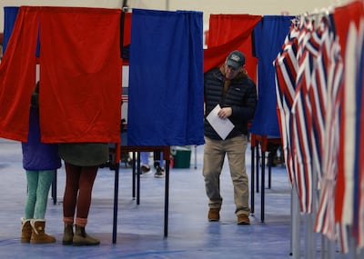 Voters fill out their ballots at a polling station in Bedford, New Hampshire. AFP