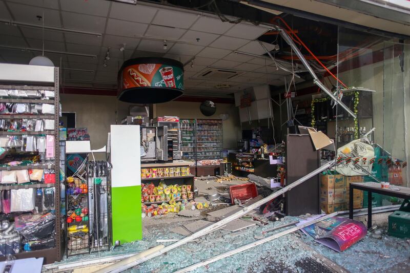 Debris are scattered on the floor of a damaged store a day after a strong quake struck in Digos, Davao del Sur province, southern Philippines Thursday, Oct. 17, 2019. A powerful and shallow earthquake hit several southern Philippine provinces Wednesday night injuring some people in collapsed houses and prompting thousands to scramble out of homes, shopping malls and a hospital in panic, officials and news reports said. (AP Photo)