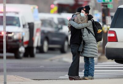 Women hug on the corner of Broadway and Table Mesa Drive near a King Soopers grocery store where a shooting took place, Monday, March 22, 2021, in Boulder, Colo. (AP Photo/Joe Mahoney)
