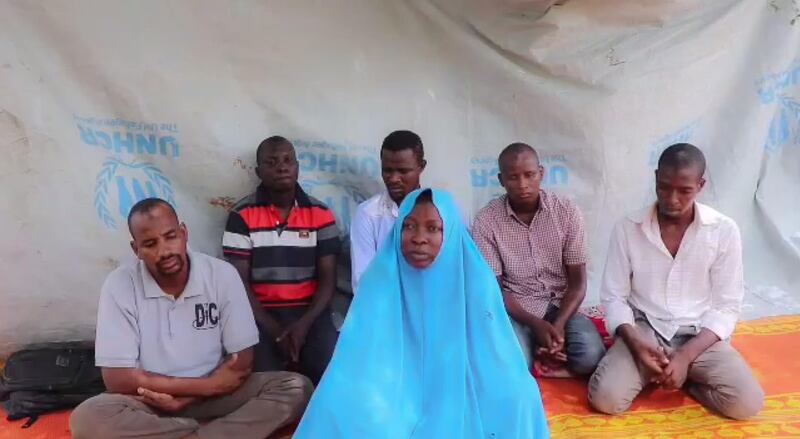 A screen grab taken from a video released on July 25, 2019 by the IS-linked Islamic State West Africa Province (ISWAP) purportedly shows a female aid worker from the NGO Action Against Hunger and five male colleagues kidnapped in an attack in northeast Nigeria last week.  Aid group 'Action Against Hunger ' said that one of its staff members along with three health workers and two drivers were missing after their convoy was attacked on July 18, 2019, near the border with Niger. The hostages are believed to be held in the ISWAP enclave on the shores of Lake Chad. ISWAP is a splinter group of Boko Haram that swore allegiance in 2016 to IS leader Abu Bakr al-Baghdadi.
 - RESTRICTED TO EDITORIAL USE - MANDATORY CREDIT "AFP PHOTO / IS-linked Islamic State West Africa Province (ISWAP)" - NO MARKETING - NO ADVERTISING CAMPAIGNS - DISTRIBUTED AS A SERVICE TO CLIENTS
 / AFP / IS-linked Islamic State West Africa Province (ISWAP) / Handout / RESTRICTED TO EDITORIAL USE - MANDATORY CREDIT "AFP PHOTO / IS-linked Islamic State West Africa Province (ISWAP)" - NO MARKETING - NO ADVERTISING CAMPAIGNS - DISTRIBUTED AS A SERVICE TO CLIENTS
