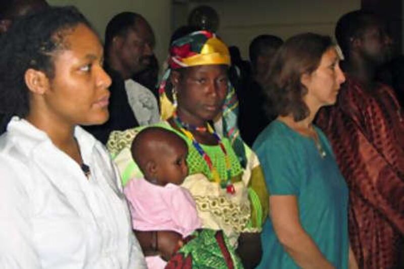 Hadijatou Mani, former slave centre, is flanked by Anti-Slavery International workers at a court appearance in April.