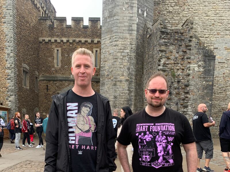 Nick Lansdowne, left, and Geoffrey Easton came from London and Cambridge, wearing T-shirts of Bret “The Hitman” Hart, one of their favourite wrestlers who was doing a signing in the city earlier in the day.

