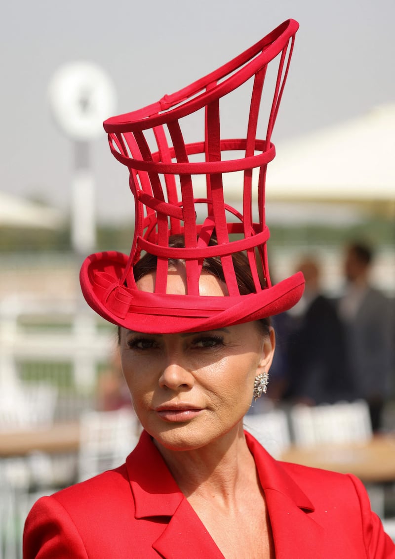 A guest arrives to attend the Dubai World Cup horse racing event at the Meydan racecourse on March 26, 2021. AFP