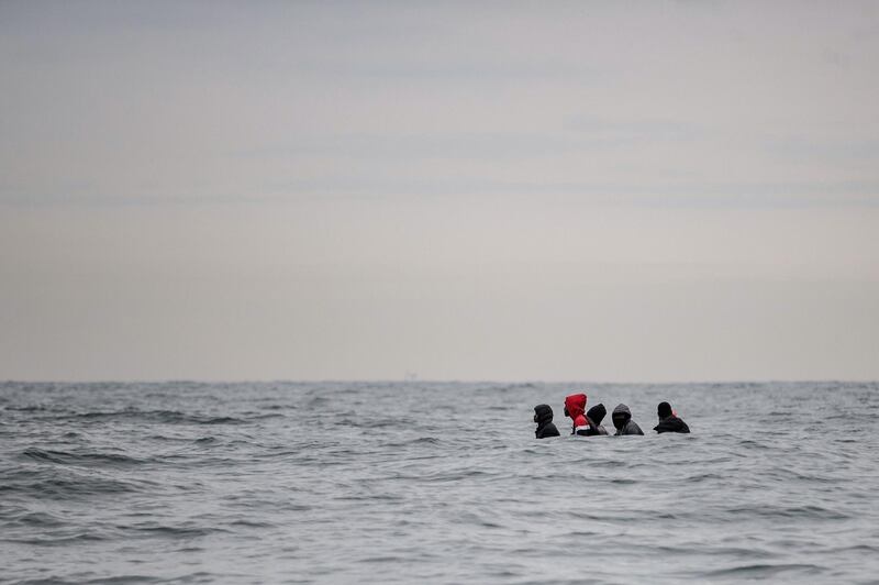 -- AFP PICTURES OF THE YEAR 2020 --

Migrants sit onboard a boat navigating in agitated waters between Sangatte and Cap Blanc-Nez (Cape White Nose), in the English Channel off the coast of northern France, as they attempt to cross the maritime borders between France and the United Kingdom on August 27, 2020. The number of migrants crossing the English Channel -- which is 33,8 km (21 miles) at the closest point in the Straits of Dover --  in small inflatable boats has spiralled over the summer of the 2020. According to authorities in northern France some 6,200 migrants have attempted the crossing between January 1 and August 31, 2020, compared with 2,294 migrants for the whole of 2019. - 
 / AFP / Sameer Al-DOUMY
