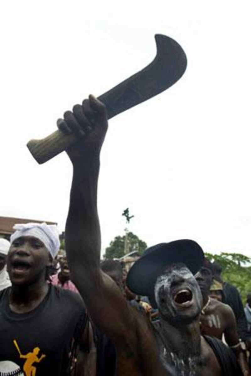 Members of Nigeria's Iljaw tribe celebrate at a carnival held in 2005 to honour the late local leader Major Isaac Adak Boro.