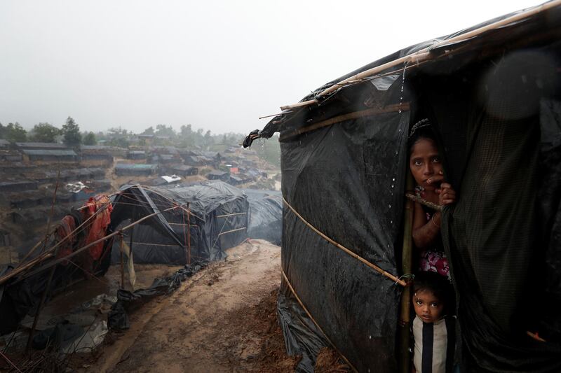 Rohingya refugees look out from a shelter in Cox's Bazar, Bangladesh. Cathal McNaughton / Reuters