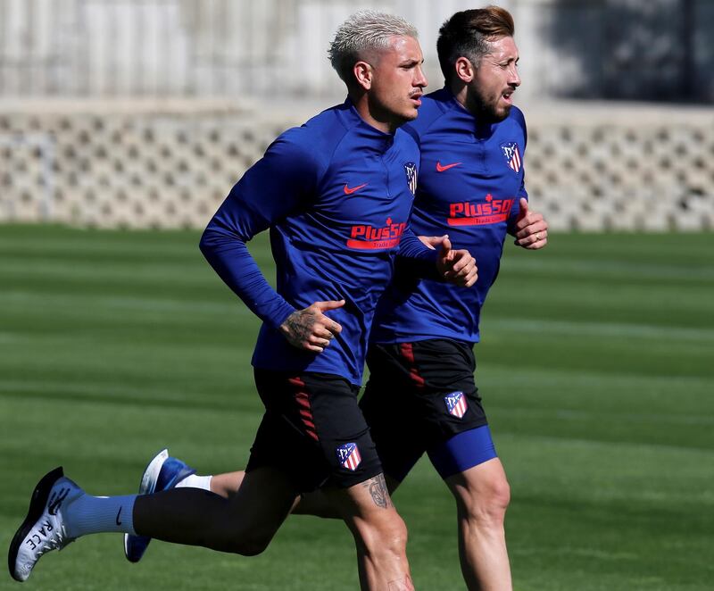 Jose Maria Gimenez (L) and Hector Herrera (R) during a training session at Wanda Sport City. EPA