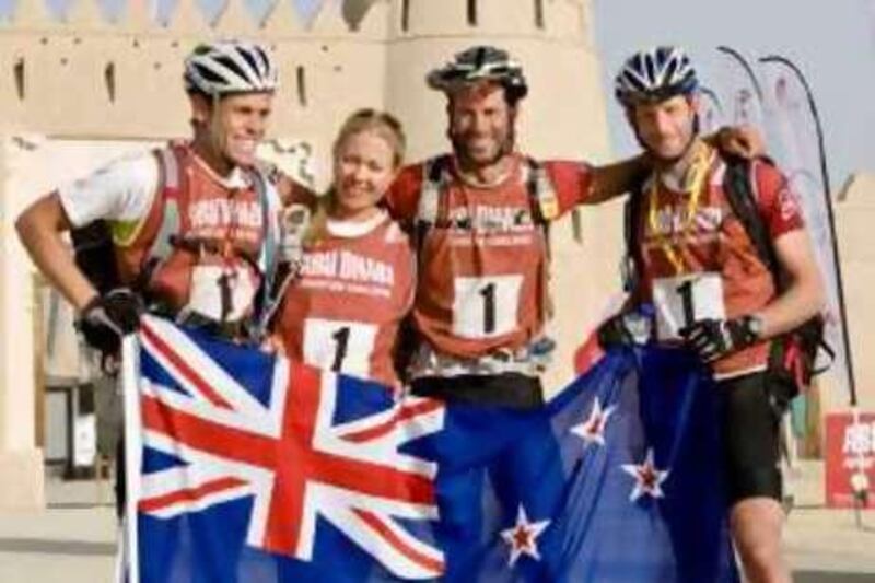 Al Ain - December 17, 2008: The Abu Dhabi Adventure Challage overall winner is New Zealand team, Desert Islands, (L-R) Jarad Kholar, Elina Ussher, Richard Ussher (Captain), and Jay Henry.  The final event of the six day Abu Dhabi Adventure Challenge finished at Jahahili Fort in Al Ain. Lauren Lancaster / The National.  *** Local Caption ***  LL_17.12.08 - ADAdventureChallenge010.jpg