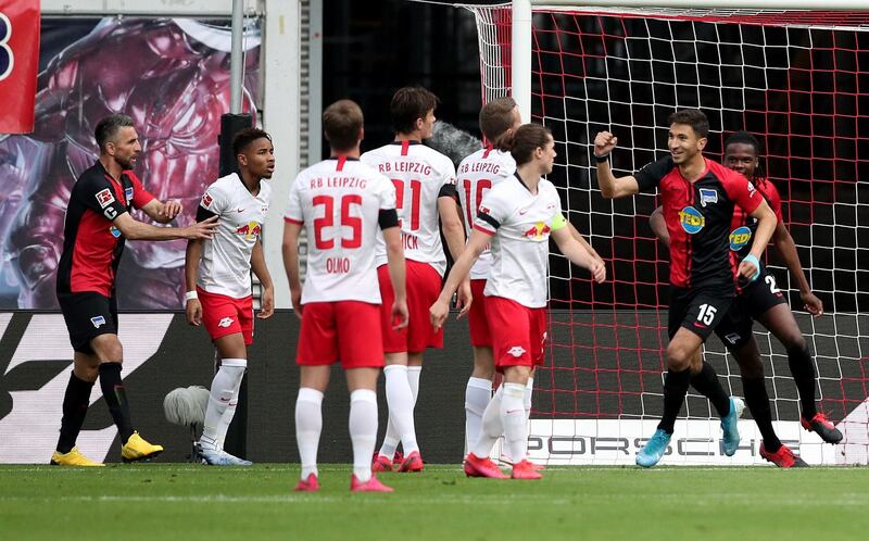 Hertha Berlin midfielder Marko Grujic, right, celebrates scoring the opening goal. AFP