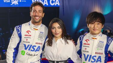 Amna Al Qubaisi of the UAE, centre, with RB drivers Daniel Ricciardo of Australia, left, and Yuki Tsunoda of Japan. Getty