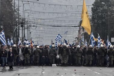 Protesters are blocked by riot police in Athens. AFP