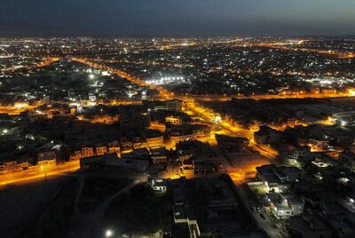 This picture taken on June 10, 2021 shows an aerial night view of Iraq's northern city of Mosul, on the seventh anniversary of the city's fall to Islamic State (IS) group fighters.  / AFP / Zaid AL-OBEIDI
