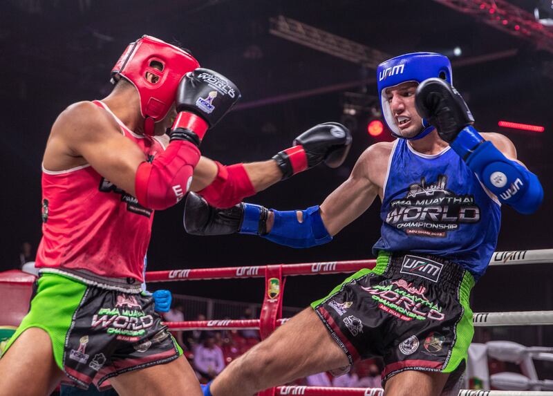 UAE's Ilyass Habibali, in red, defeats  Mustafa Al Tekreet of Iraq.