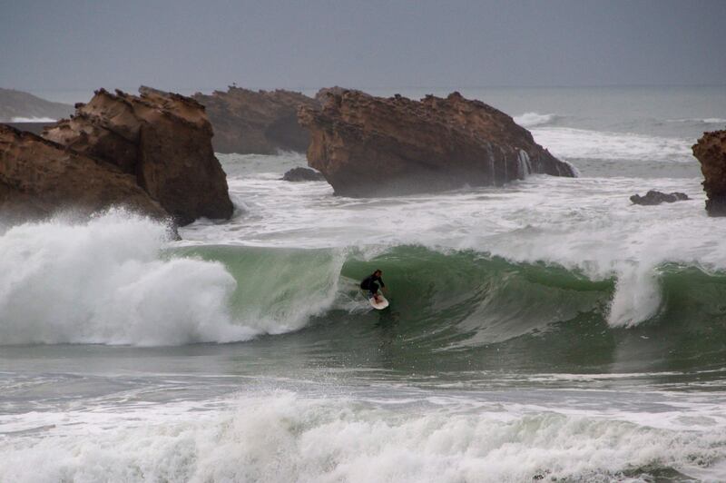 A surfer rides a wave during a heavy swell at Biarritz in south-west France, on Tuesday, October 27. AFP