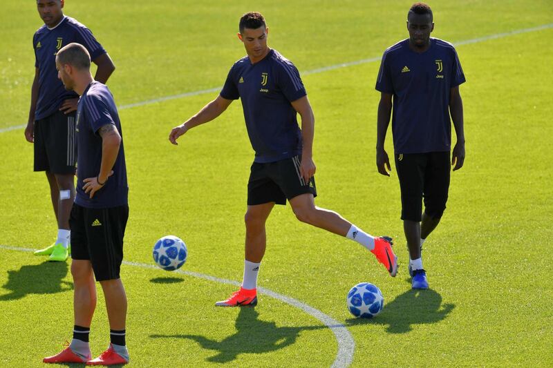 Cristiano Ronaldo and  Blaise Matuidi attend a training session. AFP