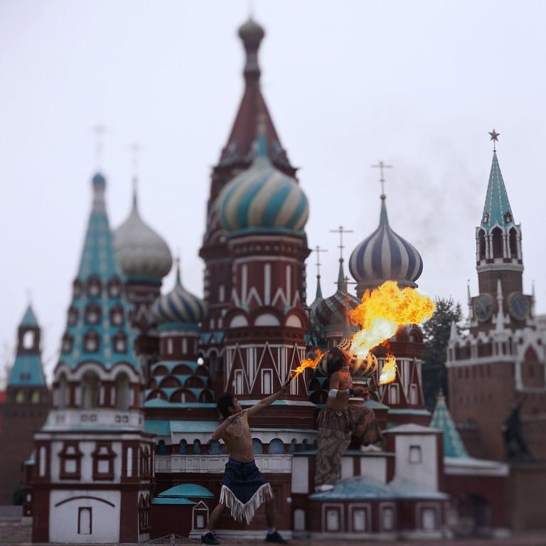 Two artists performing in a mini replica of Moscow Kremlin.