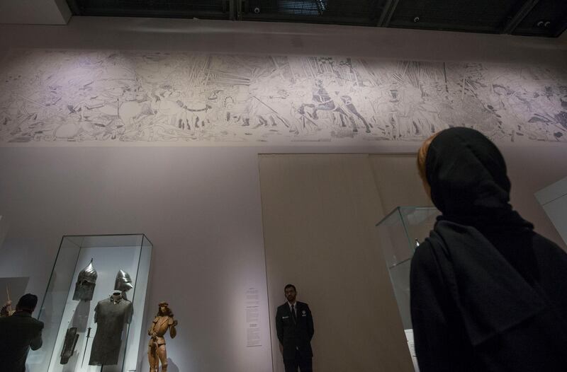 Abu Dhabi, United Arab Emirates- Artwork reflected at the wall at Furusiyya The Art of Chivalry between East and West, which draws links between knightly traditions of Europe and the Middle East at Louvre Abu Dhabi.  Leslie Pableo for The National 