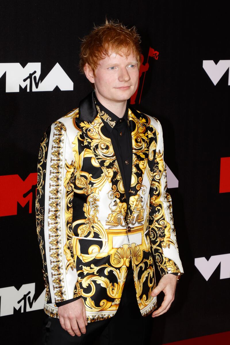 British singer Ed Sheeran, in Versace, arrives on the MTV Video Music Awards red carpet.