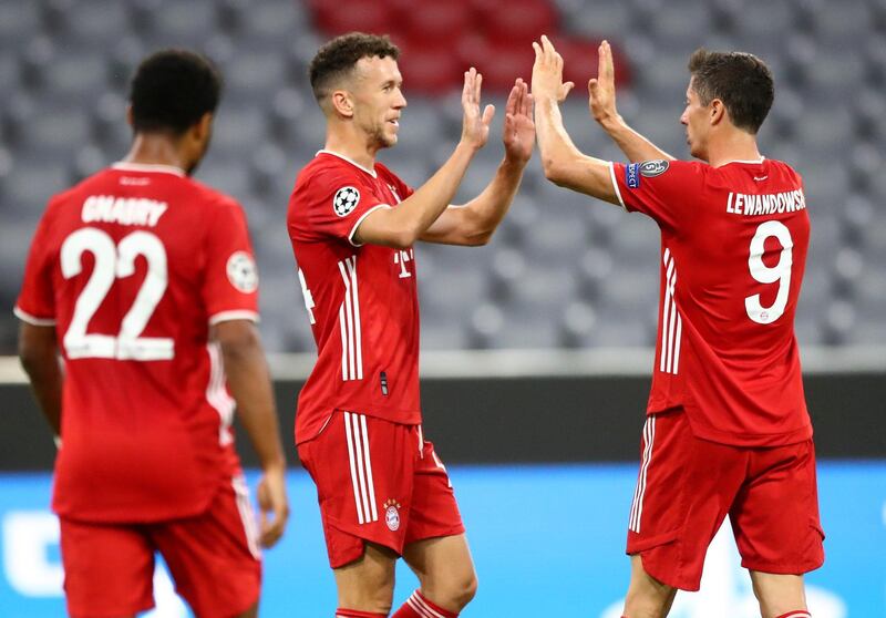 Bayern's Ivan Perisic, centre, is congratulated by teammate Robert Lewandowski after scoring his team's second goal. AP