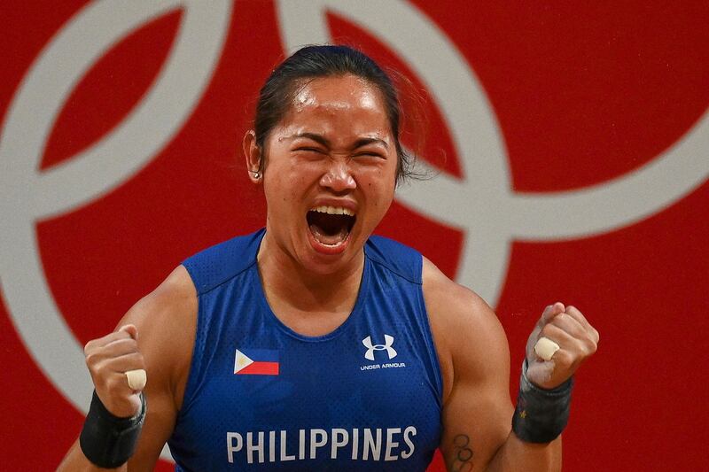 Philippines' Hidilyn Diaz reacts after placing first in the women's 55kg weightlifting competition.