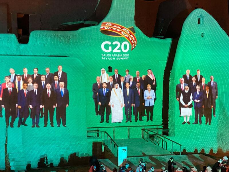 "Family Photo" for annual G20 Summit World Leaders is projected onto Salwa Palace in At-Turaif, one of Saudi Arabia?s UNESCO World Heritage sites, in Diriyah, Saudi Arabia. REUTERS