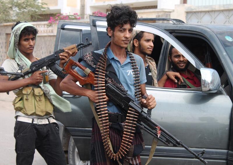 Fighters loyal to Yemen’s fugitive president Abdrabu Mansur Hadi in the port city of Aden’s Dar Saad suburb, on April 27, 2015. Saleh Al Obeidi / AFP