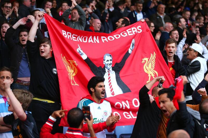 Liverpool fans celebrate following their team's 2-1 victory during the Premier League match between West Ham United and Liverpool at Boleyn Ground on Sunday in London, England. Julian Finney / Getty Images / April 6, 2014  