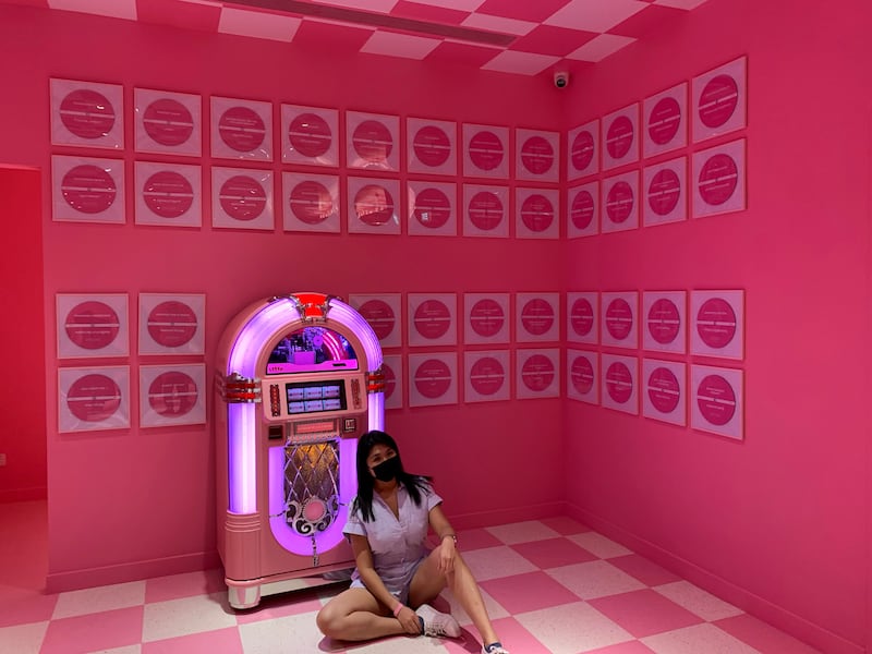 Visitor poses with a pink jukebox in Museum of Ice Cream in Singapore. Reuters