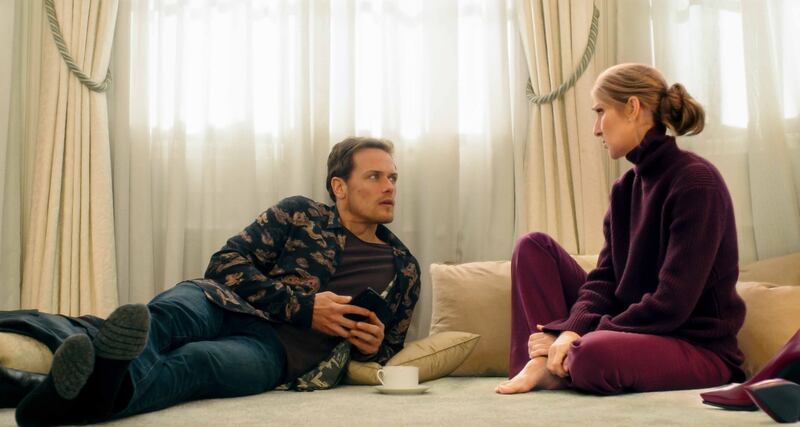 Heughan with singer Celine Dion in a scene 