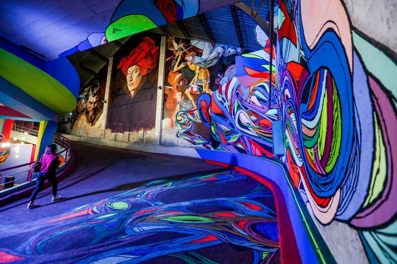 A woman looks at street art creations displayed as part of the exhibition 'Strokar Inside' at a former supermarket in Brussels, Belgium. 'Strokar Inside' is an international platform of urban art. EPA