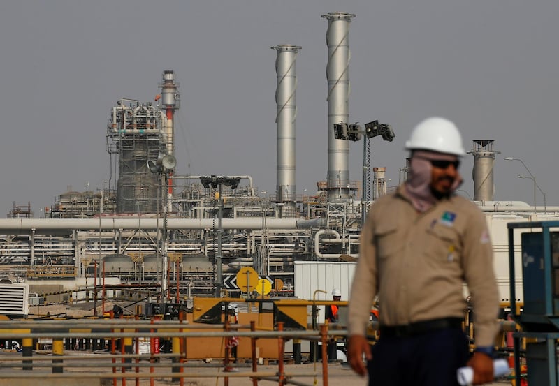 FILE PHOTO: An employee looks on at Saudi Aramco oil facility in Abqaiq, Saudi Arabia October 12, 2019. REUTERS/Maxim Shemetov//File Photo