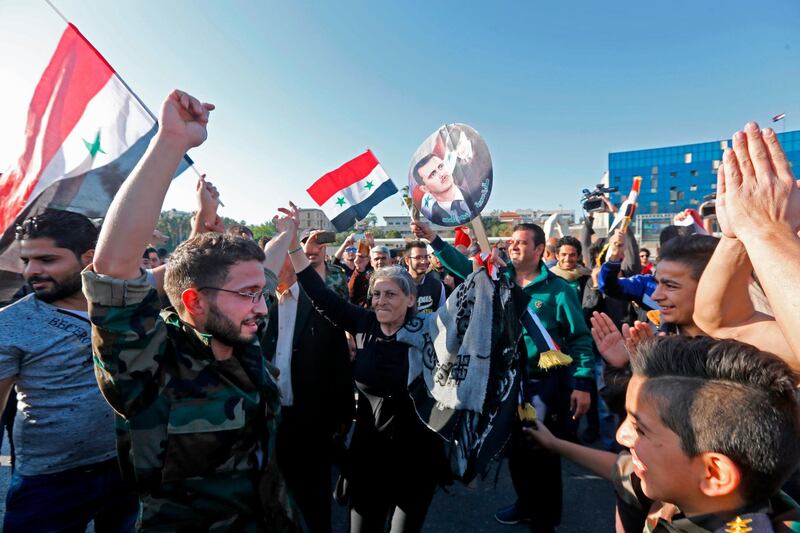 There was a large turnout of demonstrators supporting president Assad in Umayyad Square in Damascus. Louai Beshara / AFP Photo