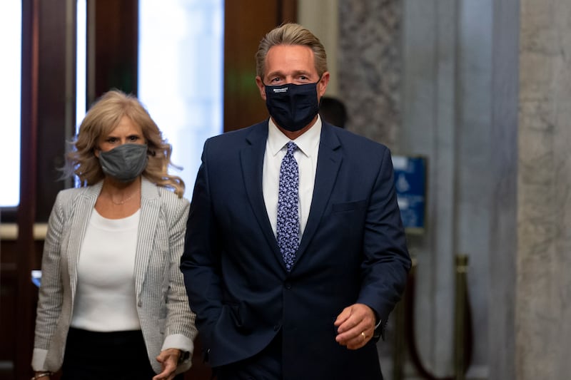 Jeff Flake walks with his wife Cheryl Flake, on Capitol Hill in Washington. EPA