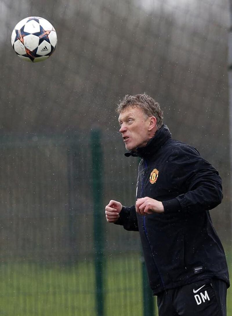 Manchester United's manager David Moyes heads a ball during a training session at the club's Carrington training complex in Manchester, on Tuesday before United play Olympiakos on Wednesday. Phil Noble / Reuters / March 18, 2014