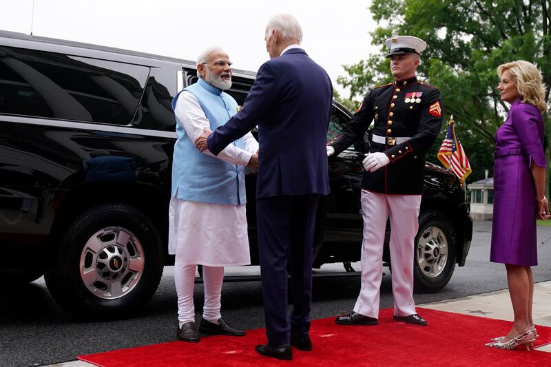 Mr Biden greets Mr Modi in Washington. AP