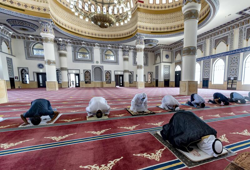 Dubai, United Arab Emirates - December 03, 2020: People pray at Al Farooq Omar Bin Al Khattab Mosque. Thursday, December 3rd, 2020 in Dubai. Chris Whiteoak / The National