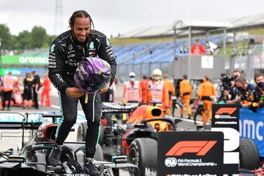 Lewis Hamilton celebrates on top of his Mercedes after winning the Hungarian Grand Prix. AP Photo