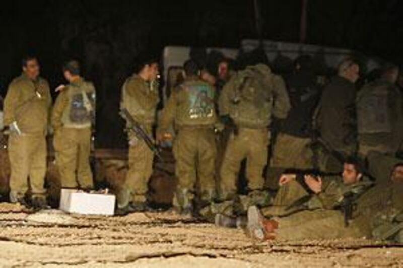 Israeli infantry reservist soldiers prepare to deploy into the Gaza Strip.