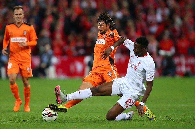 Thomas Broich of Brisbane Roar and Divock Origi of Liverpool compete for the ball during their international friendly on Friday in Australia. Chris Hyde / Getty Images
