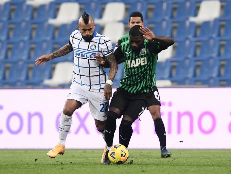 Inter Milan's Arturo Vidal battles for possession with with Jeremie Boga of Sassuolo. Reuters