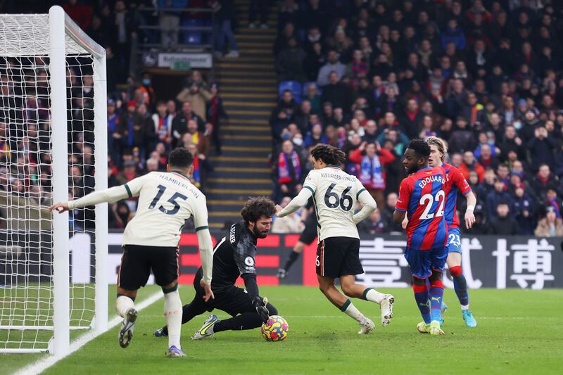 Liverpool keeper Alisson Becker saves Odsonne Edouard's back-heeled effort for Crystal Palace. Getty