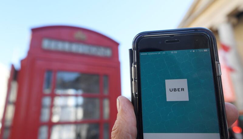 A photo illustration shows the Uber app logo displayed on a mobile telephone, as it is held up for a posed photograph in central London September 22, 2017. REUTERS/Toby Melville