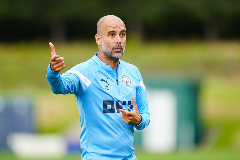 Manager Pep Guardiola oversees training. Getty