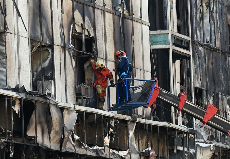 A rescue team searches for survivors. 