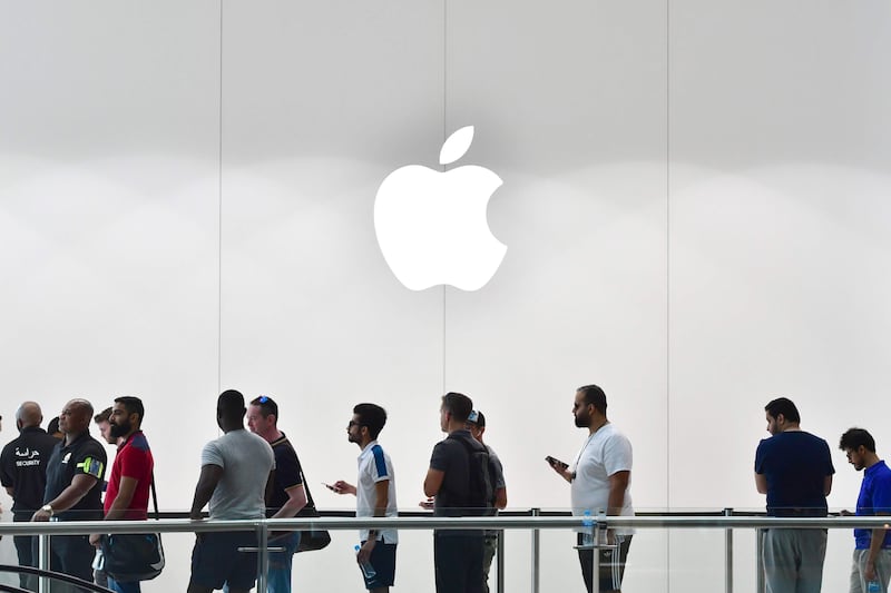 Customers stand in line to purchase the new Apple iPhone 8 at Dubai Mall Apple Store in Dubai, on September 23, 2017.
The new Apple iPhone 8 and 8 Plus, as well as the updated Apple Watch and Apple TV, went on sale today. / AFP PHOTO / GIUSEPPE CACACE