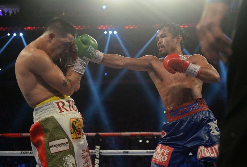 The victory for Pacquiao was scored 120-108, 119-109, 118-110 by the three judges. Dale de la Rey / AFP