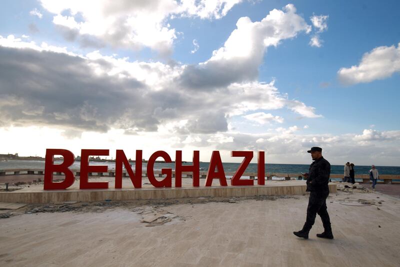 A Libyan security guard walks on the seaside promenade in the eastern Libyan coastal city of Benghazi on January 13, 2021. Libya negotiations hosted by the United Nations resumed in Geneva today.  / AFP / Abdullah DOMA
