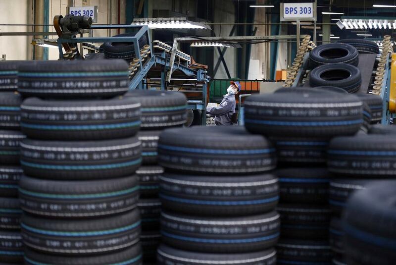 A tyre factory’s production line in Jiaxing. China is aiming to redirect its economy by promoting domestic consumption ahead of exports. William Hong / Reuters

