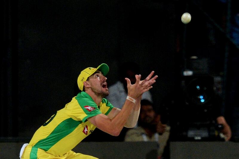 Australia's Mitchel Starc catches out India batsman Rohit Sharma. AFP