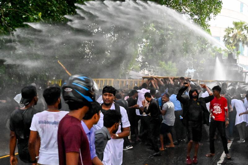 Police fire water cannon on students during an anti-government demonstration demanding the resignation of Sri Lanka's President Gotabaya Rajapaksa in Colombo, Sri Lanka. AFP